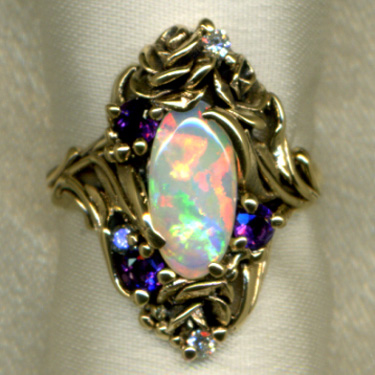 Opal with Tanzanite ring in 14k Gold